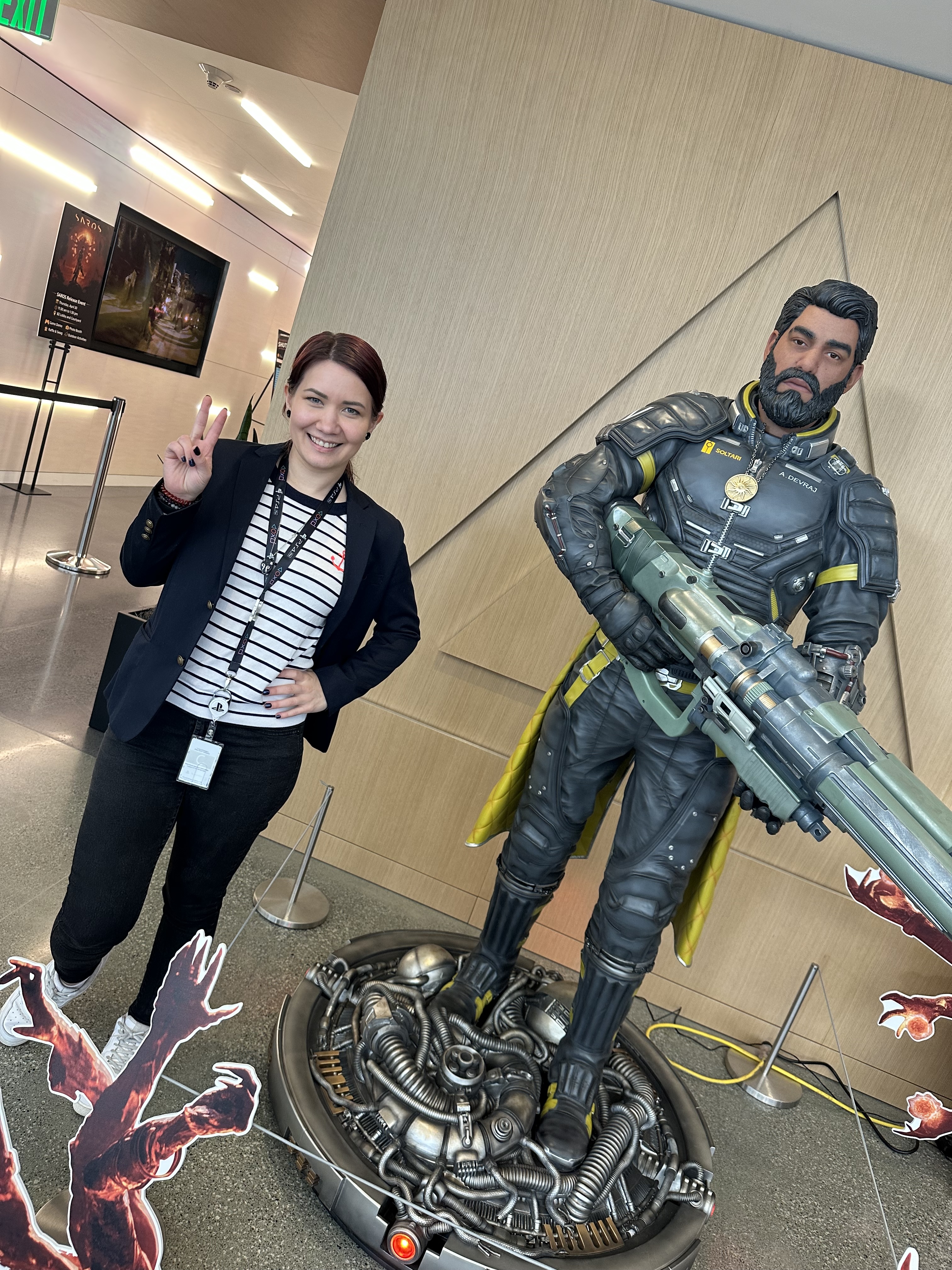 Alexandra Lukinicheva at PlayStation Studios beside a character display